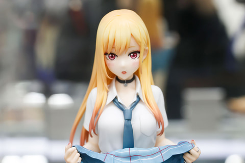 She's so cute as she bashfully flips up her skirt! 